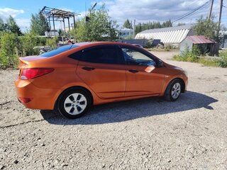 2014 Hyundai Solaris I Рестайлинг, оранжевый, 550000 рублей, вид 3