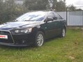 2012 Mitsubishi Lancer X Рестайлинг, чёрный, 1050000 рублей - вид 1