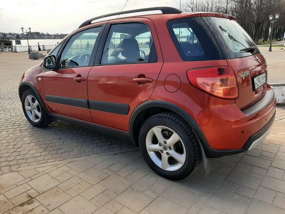 2011 Suzuki SX4 I (Classic) Рестайлинг, оранжевый - вид 6