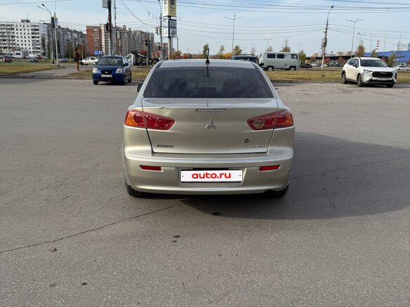 2009 Mitsubishi Lancer X, бежевый, 395000 рублей - вид 4