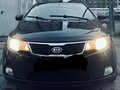 2011 Kia Cerato 4-speed II, чёрный, 700000 рублей