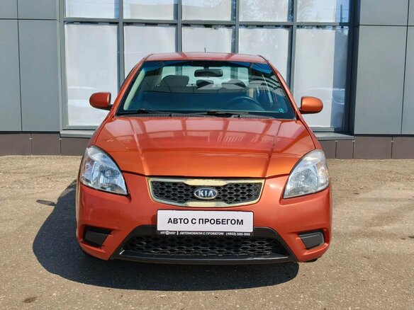 2010 Kia Rio II Рестайлинг, оранжевый - вид 1