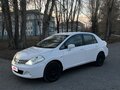 2010 Nissan Tiida I Рестайлинг, белый, 570000 рублей - вид 2