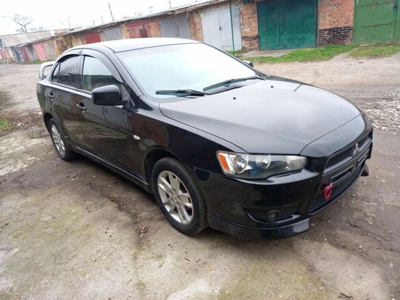 2007 Mitsubishi Lancer X, чёрный, 650000 рублей - вид 1
