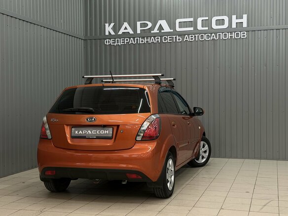 2010 Kia Rio II Рестайлинг, оранжевый, 620000 рублей - вид 1
