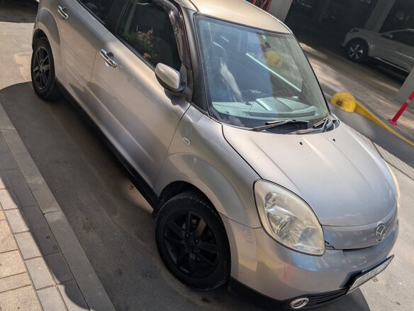 2004 Mazda Verisa, серый - вид 1