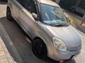 2004 Mazda Verisa, серый - вид 1