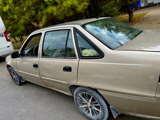 2013 Daewoo Nexia I Рестайлинг, бежевый, 220000 рублей, вид 4