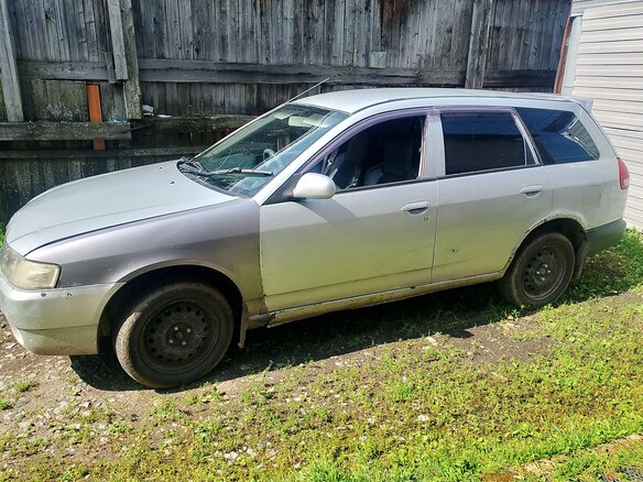 2000 Mazda Familia Y11, серебристый - вид 2