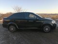 2011 Chevrolet Aveo I Рестайлинг, чёрный - вид 2