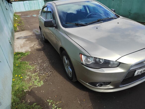 2008 Mitsubishi Lancer X, бежевый - вид 1