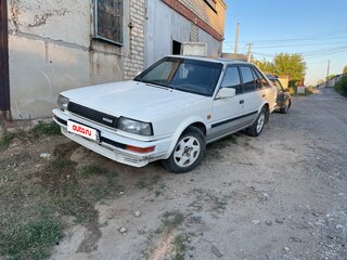 1986 Nissan Bluebird VIII (T12, T72), белый, 70000 рублей, вид 2
