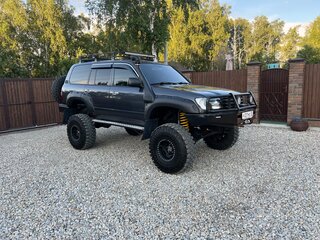 2004 Toyota Land Cruiser 105 100 Series Рестайлинг 1, серый, 4500000 рублей, вид 1