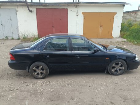 2001 Kia Clarus II, чёрный, 230000 рублей, вид 5