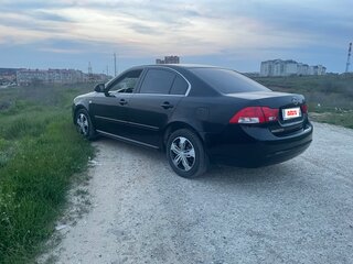 2010 Kia Magentis 5-speed II Рестайлинг, чёрный, 720000 рублей, вид 2