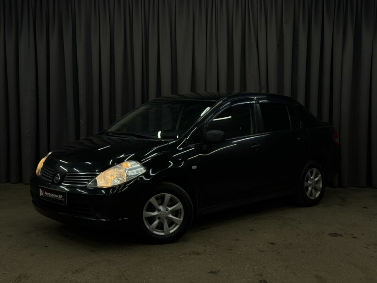 Открыть фотографии: Nissan Tiida I