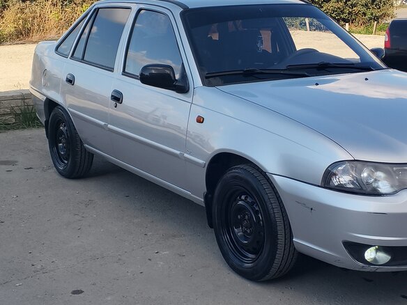 2012 Daewoo Nexia I Рестайлинг, серебристый, 295000 рублей - вид 3