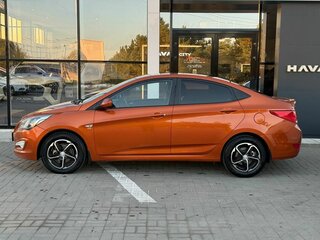 2014 Hyundai Solaris I, оранжевый, 850000 рублей, вид 2