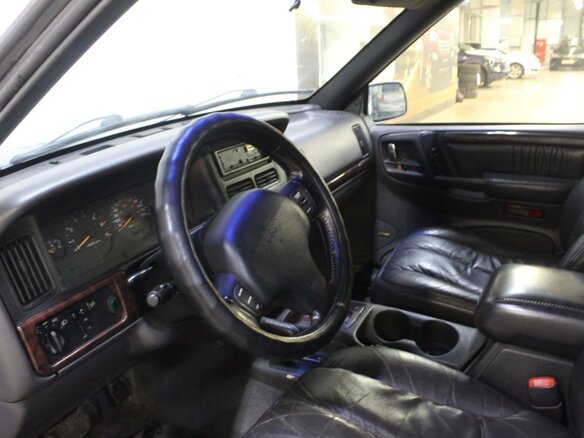 1998 Jeep Grand Cherokee I (ZJ) Рестайлинг, серый - вид 3
