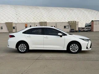 2023 Toyota Corolla XII (E210) Рестайлинг, белый, 1878219 рублей, вид 4