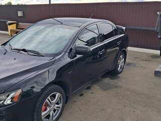 2010 Mitsubishi Lancer X, чёрный, 750000 рублей, вид 2