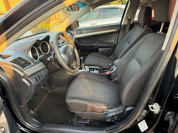 2012 Mitsubishi Lancer X Рестайлинг, чёрный, 669000 рублей - вид 10
