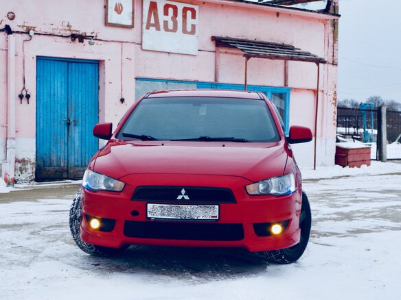 2007 Mitsubishi Lancer X, красный - вид 1
