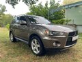 2012 Mitsubishi Outlander II Рестайлинг, коричневый, 1390000 рублей