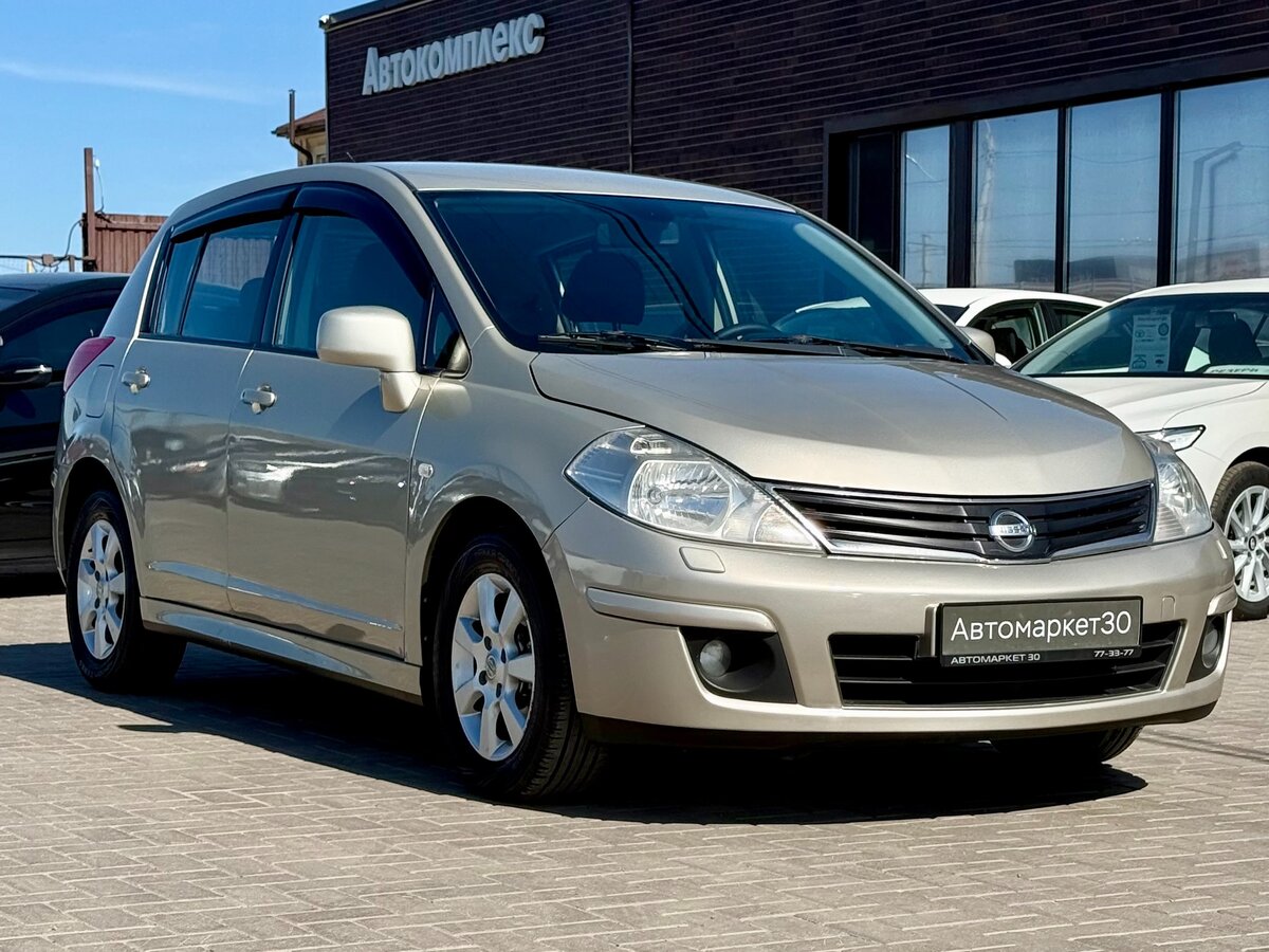 Открыть фотографии: Nissan Tiida I Рестайлинг