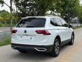 2023 Volkswagen Tiguan II Рестайлинг, белый, 2330000 рублей - вид 3