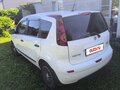 2011 Nissan Note I Рестайлинг, белый, 700000 рублей - вид 4