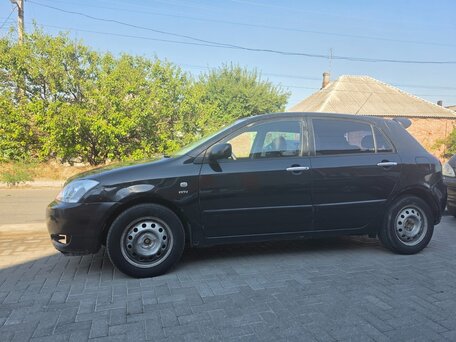 2002 Toyota Corolla IX (E120, E130), чёрный, вид 1