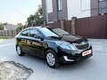 2012 Kia Rio 4-speed III, чёрный - вид 1