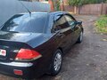 2005 Mitsubishi Lancer IX Рестайлинг, чёрный, 300000 рублей - вид 1