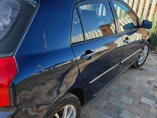 2004 Toyota Corolla IX (E120, E130) Рестайлинг, синий, 469000 рублей, вид 3