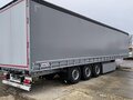 2024 Schmitz Cargobull 9084, серебристый - вид 1