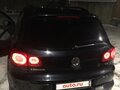 2010 Volkswagen Tiguan I, чёрный - вид 2