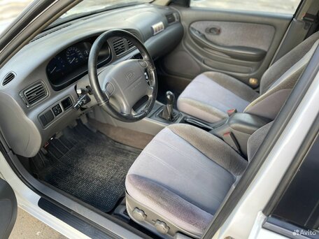1997 Kia Clarus I, белый, вид 4