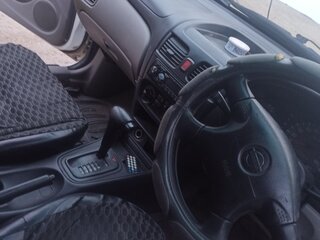 2002 Nissan Bluebird Sylphy I (G10), белый, 290000 рублей, вид 4