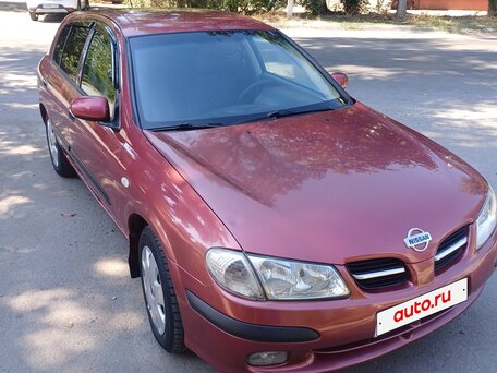 2000 Nissan Almera II (N16), пурпурный, вид 2
