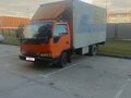 1995 Isuzu Elf (N-series), оранжевый, 1200000 рублей - вид 5
