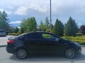 2012 Kia Rio 5-speed III, чёрный, 900000 рублей - вид 4