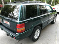 1997 Jeep Grand Cherokee I (ZJ) Рестайлинг, зелёный - вид 4