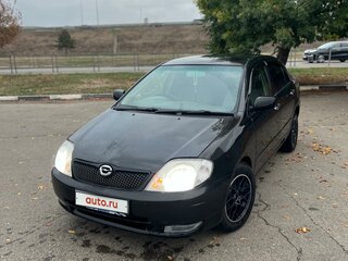2001 Toyota Corolla IX (E120, E130), чёрный, 650000 рублей, вид 3