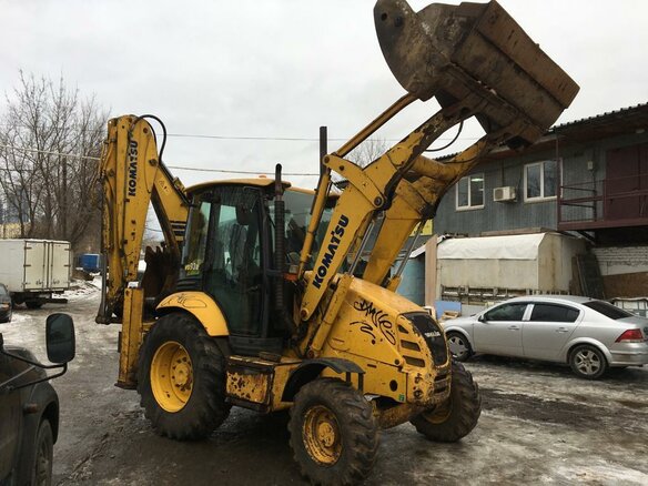 2008 Komatsu WB93R-5, жёлтый