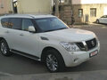 2011 Nissan Patrol VI (Y62), белый - вид 4