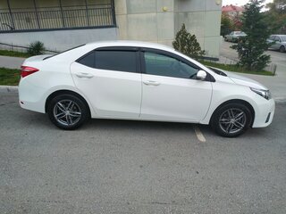 2013 Toyota Corolla XI (E160, E170, E180), белый, 1450000 рублей, вид 2