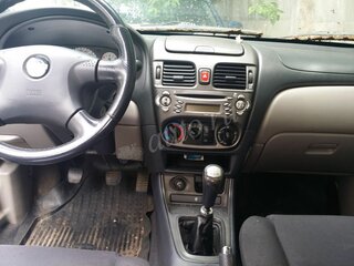 2002 Nissan Almera II (N16), серый, 330000 рублей, вид 3