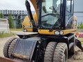 2012 Caterpillar M316, жёлтый, 6500000 рублей