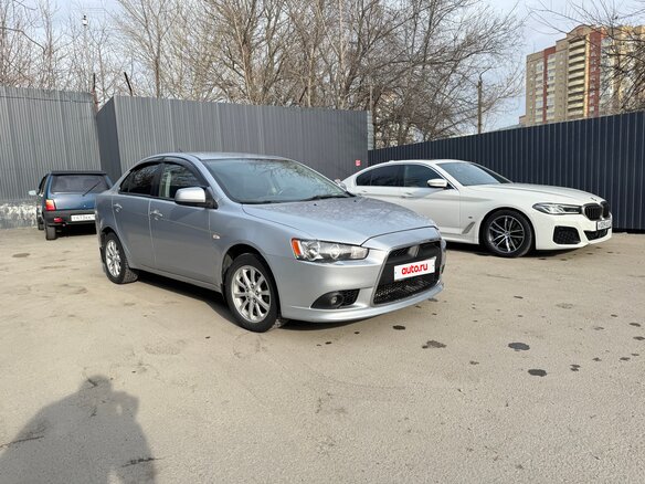 2013 Mitsubishi Lancer X Рестайлинг, серебристый, 785000 рублей - вид 2